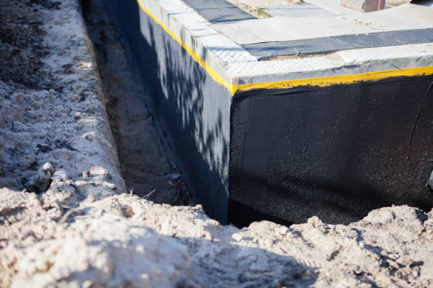 Professional Waterproofing technician working in Jackson, MI